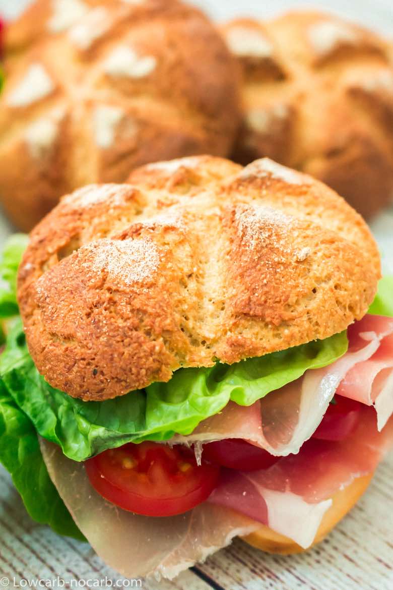 Keto Fiber Bread Rolls Recipe as a hamburger bun with veggies and proscutto