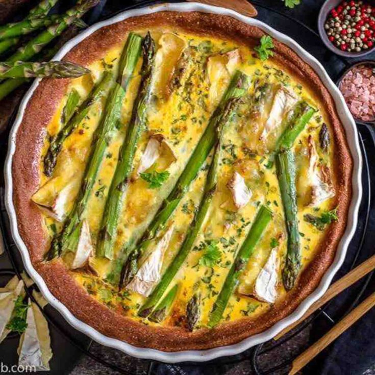 Asparagus Quiche with camembert in a white casserole dish
