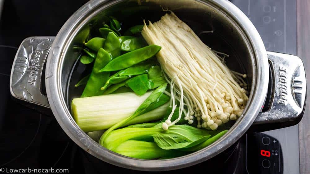 boiling the vegetables and mushrooms for ramen