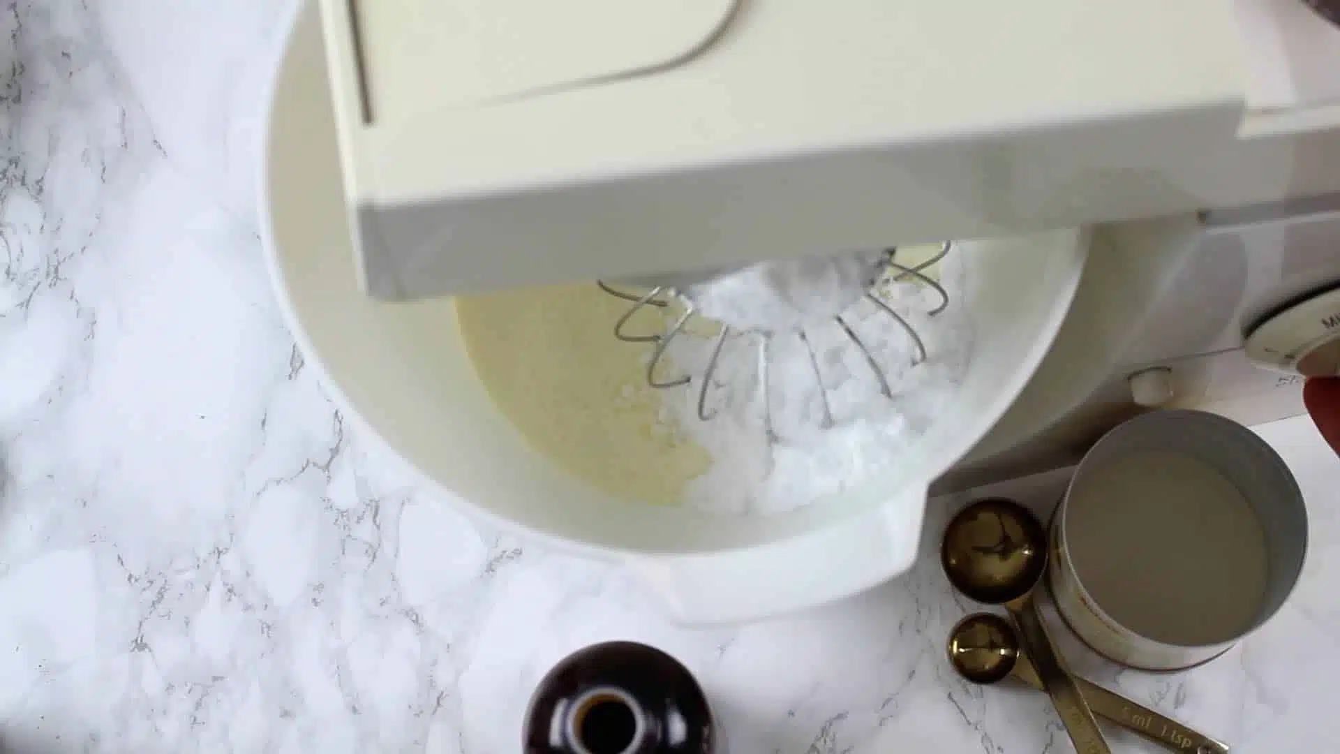 Keto Coconut Ice Cream mixing in the kitchine machine with sugar