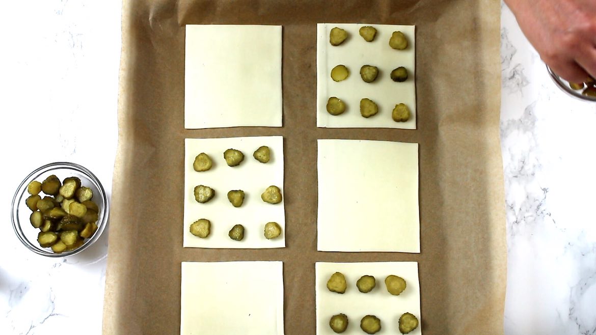 gherkins on top of the cheese slices