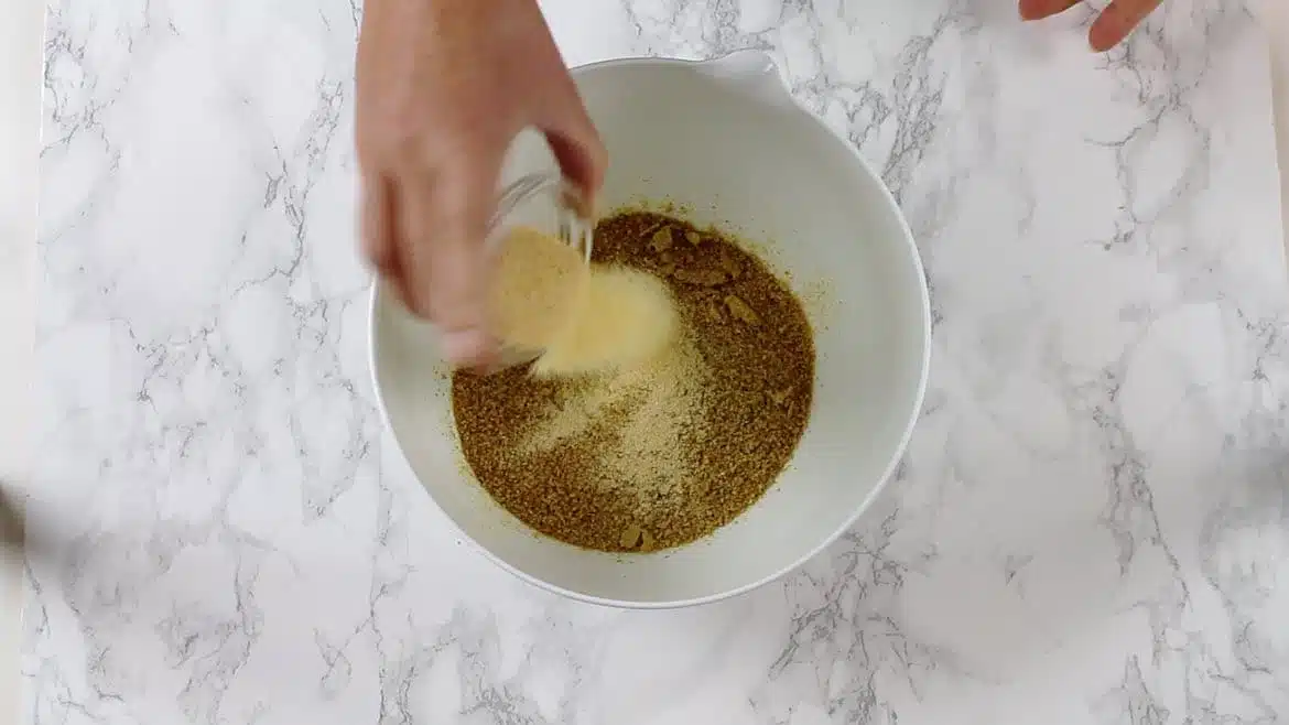 adding garlic to grounded flaxseeds