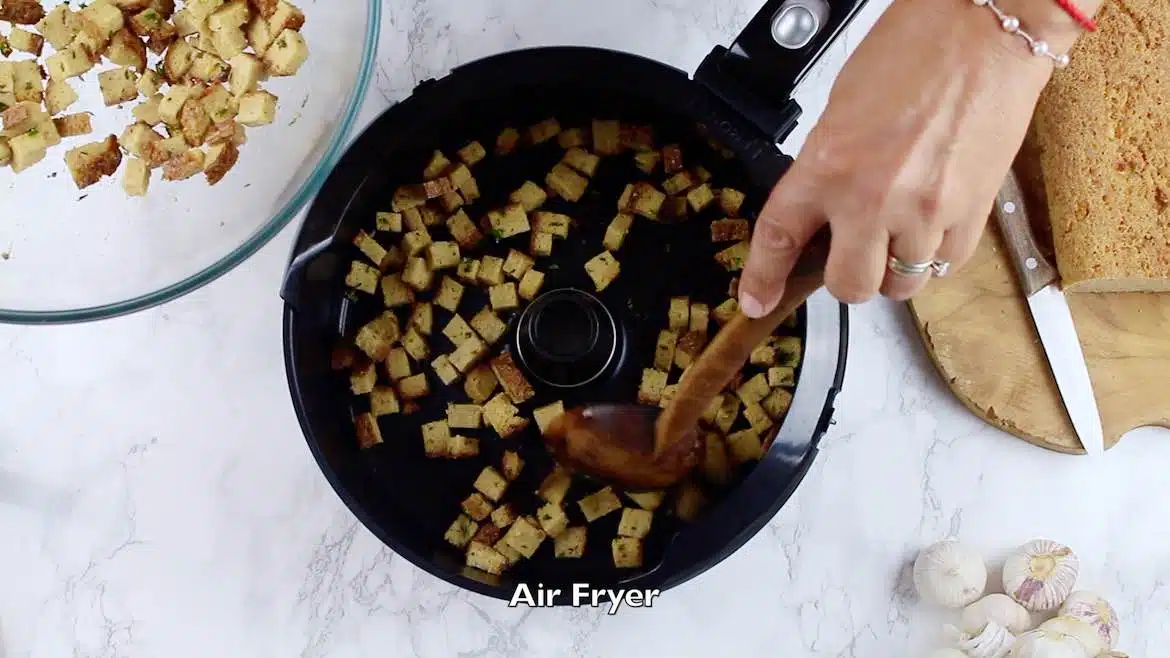 Spreading keto croutons in an Air Fryer
