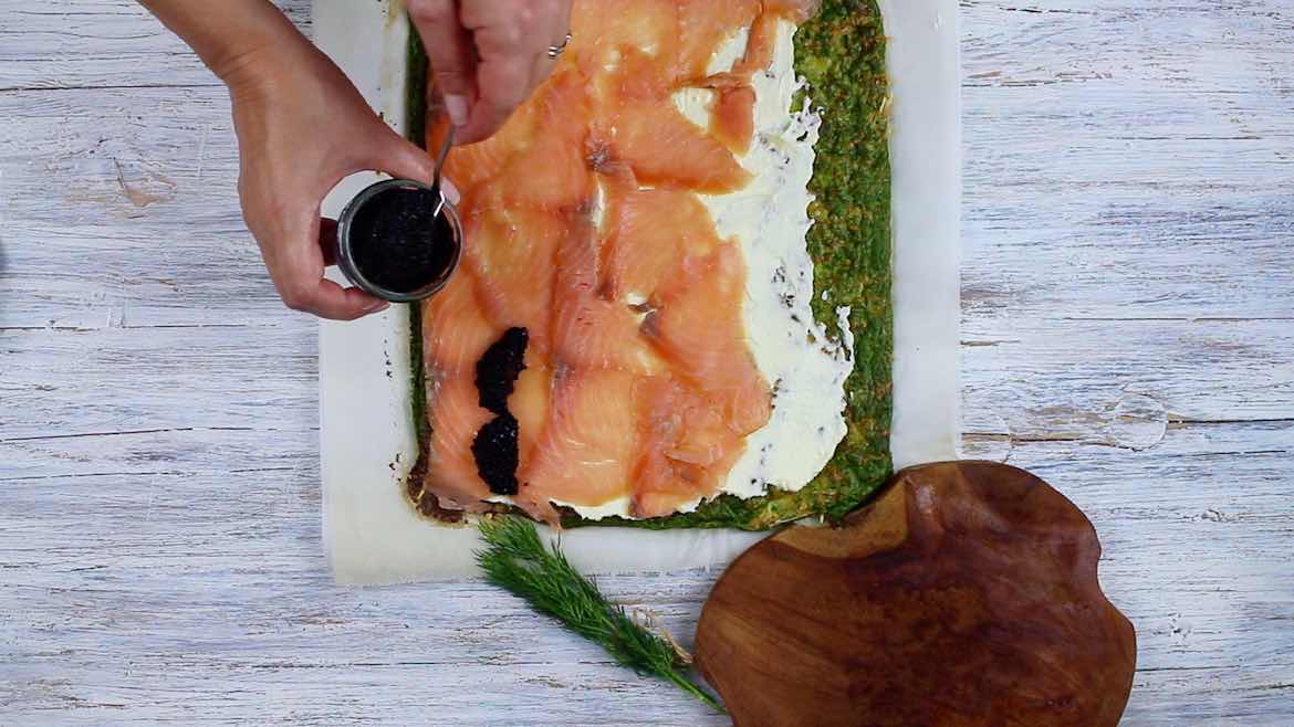 Filling caviar onto a smoked salmon Low Carb Roulade