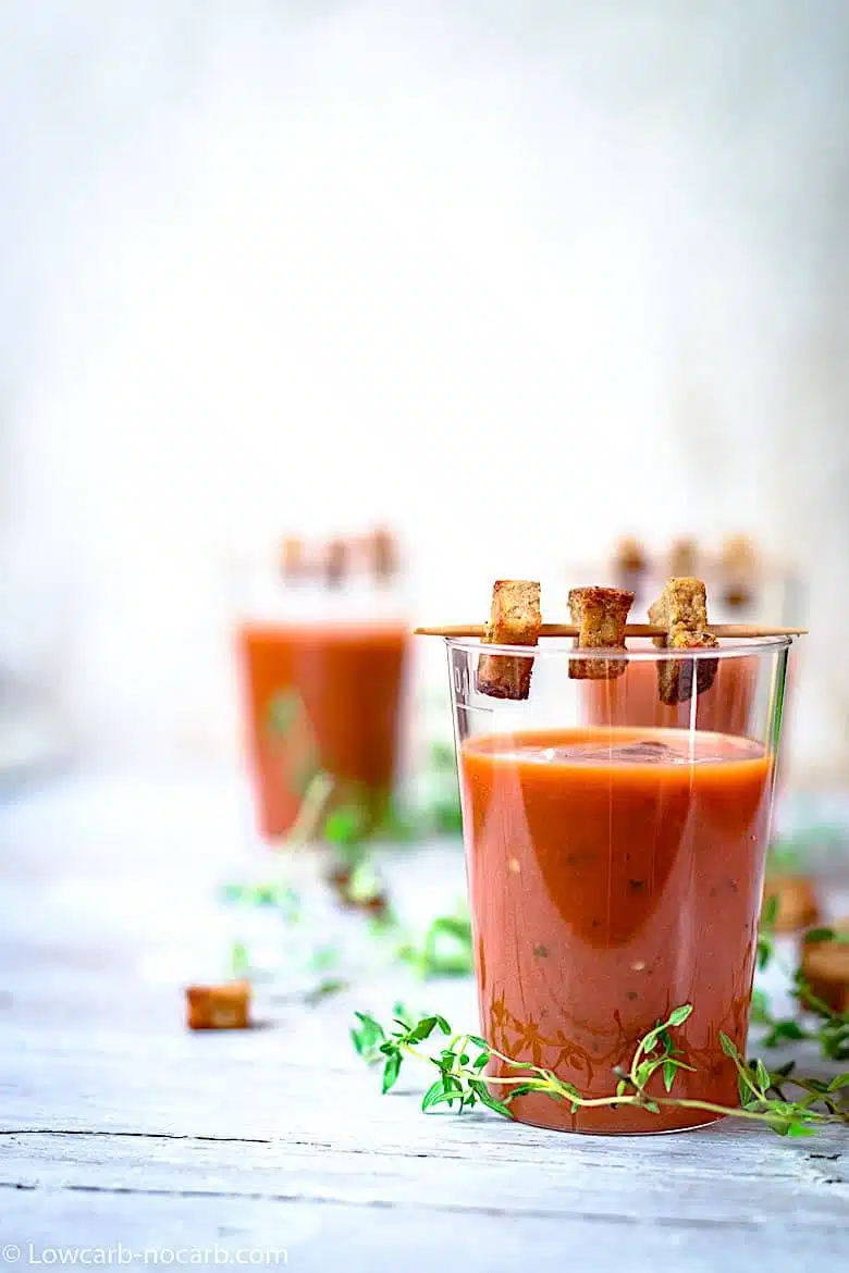 party serving Gazpacho looking tomato basil soup