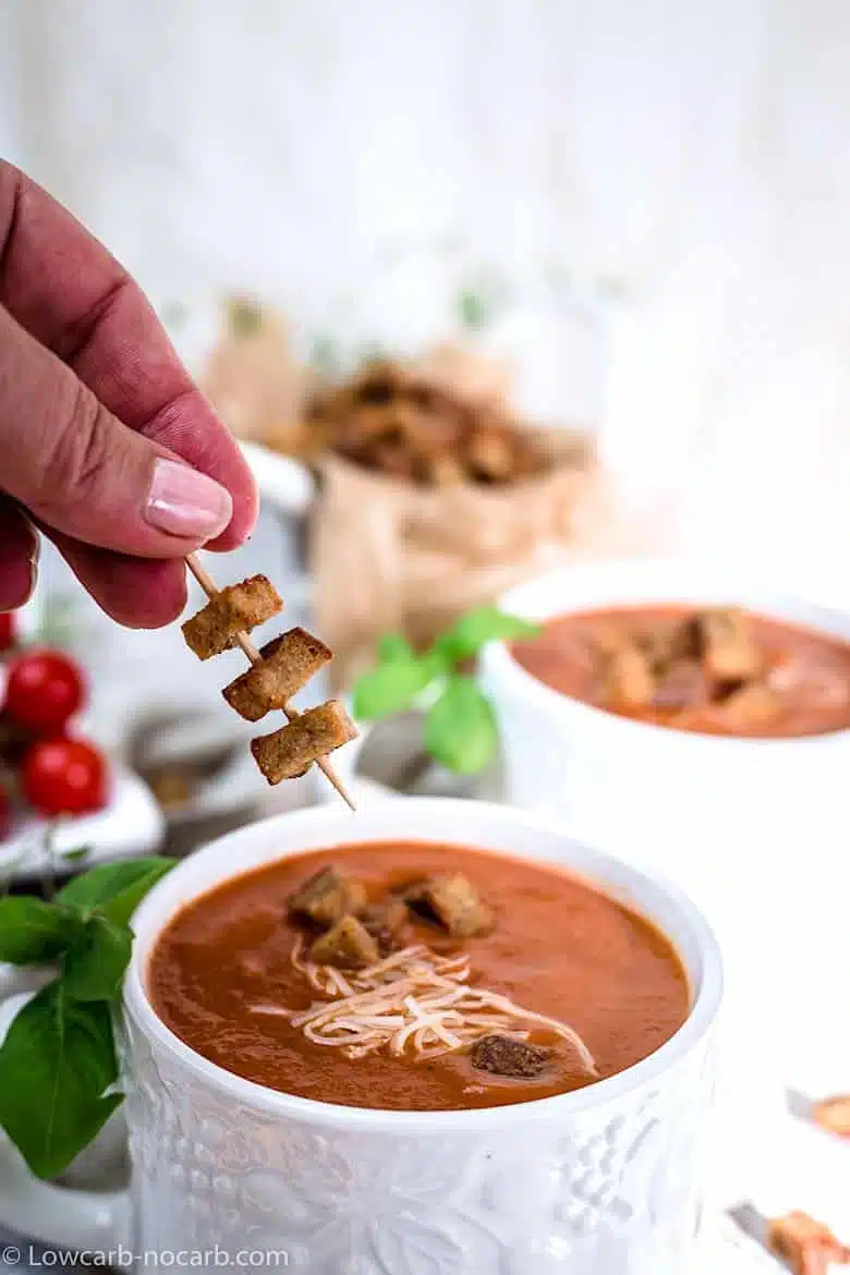 adding keto Croutons to tomato basil soup