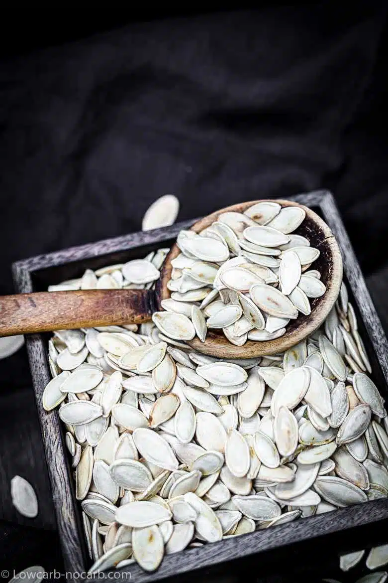 Box of a Pumpkin Seeds with a wooden spoon