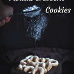 Sprinkling sugar on Keto Vanilla Crescent Cookies