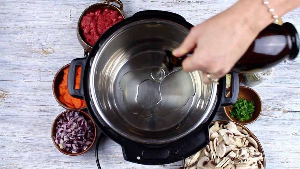 Pouring oil into the Instant Pot