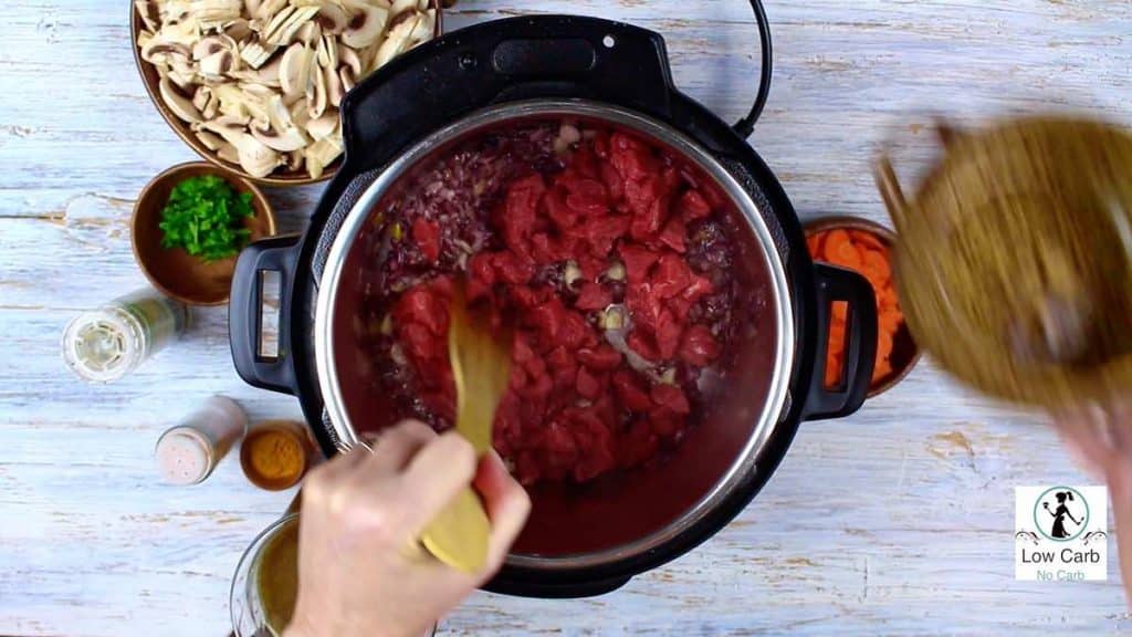 mixing beef inside the Instant Pot