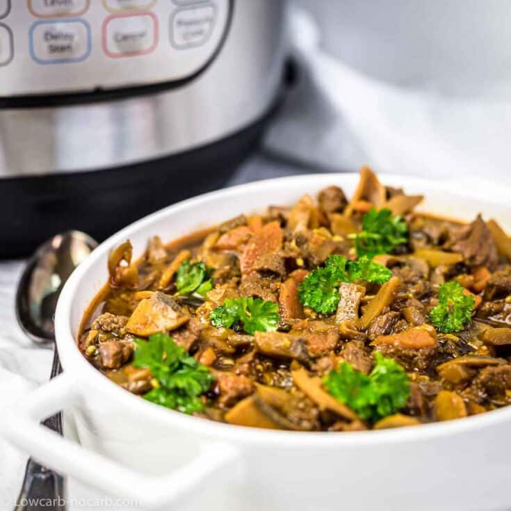 Beef Stew Goulash in a white casserole with Instant Pot in the background