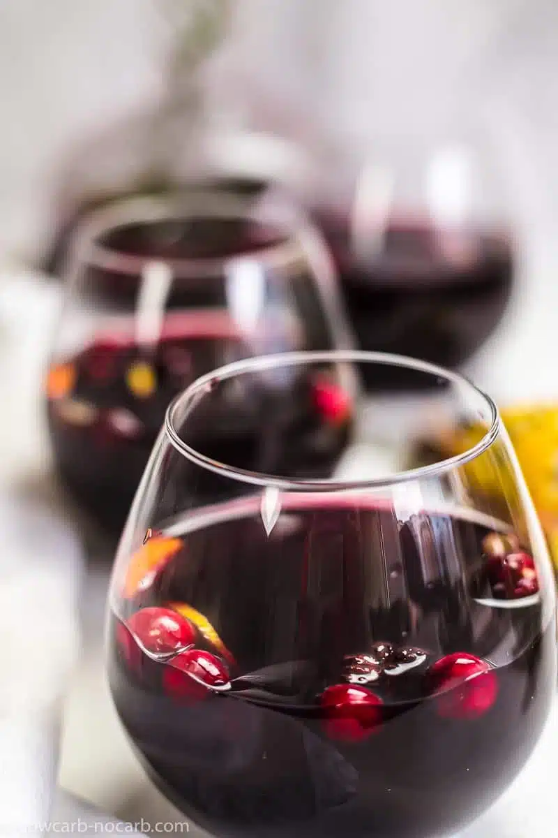 a glass of cranberry keto mulled wine