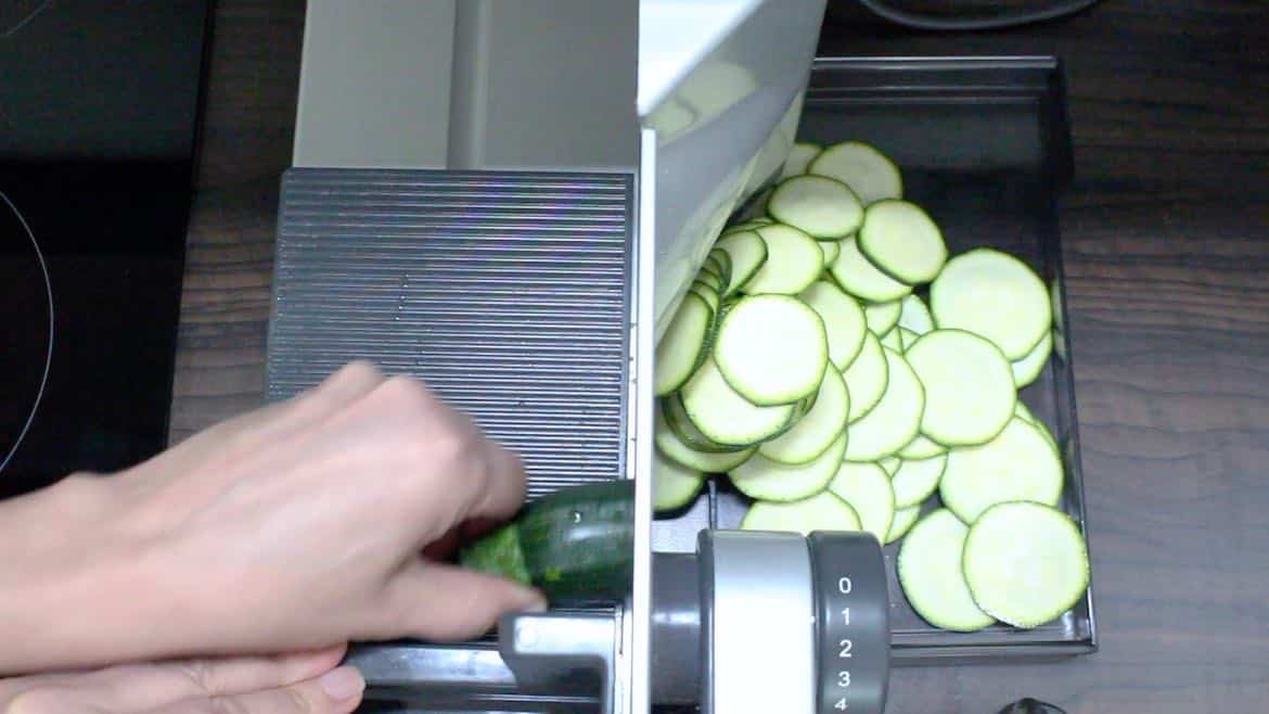 cutting zucchini into chips