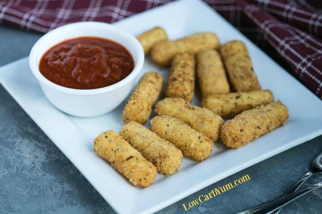 mozzarella sticks as a finger food served on a white plate
