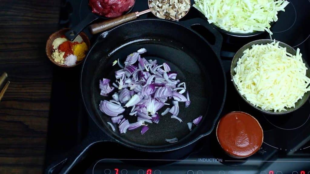 One Pan Keto Recipes starting with caramelising the onion in a skillet