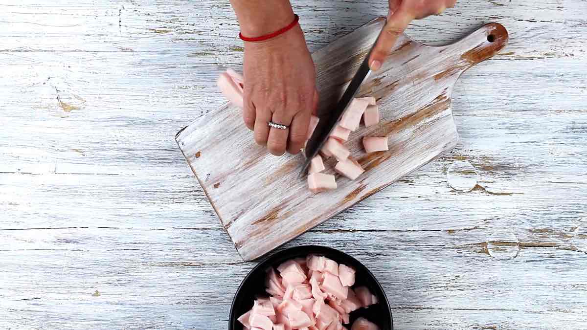 Homemade Crispy Pork Lard Scratchings Recipe cutting to pieces