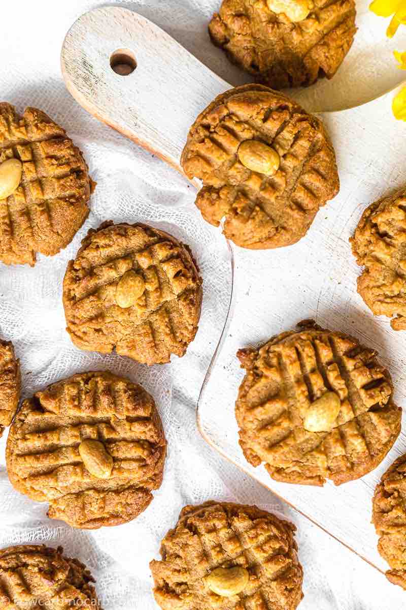 Quick and Easy Keto Peanut Butter Cookies layered on the white floor