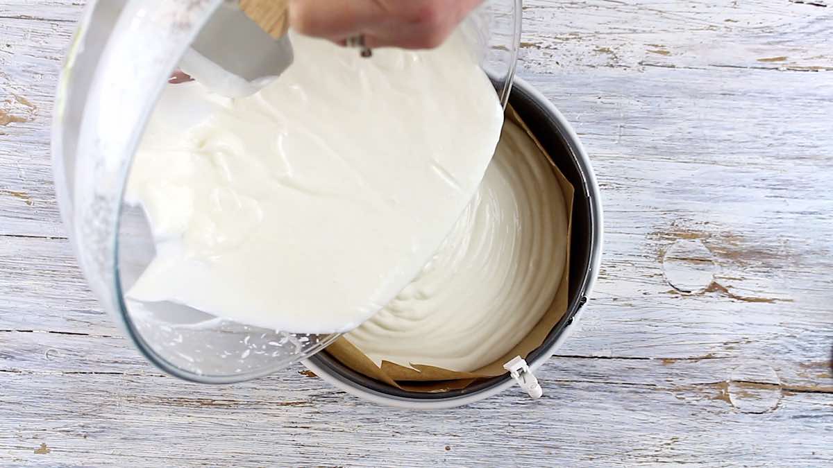 No Bake Keto Cheesecake pouring yogurt into baking dish