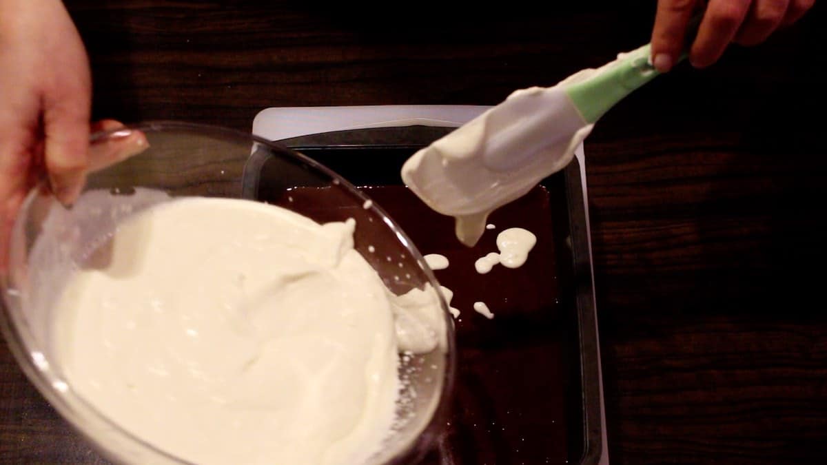 Keto Birds Milk Jello Recipe pouring white layer into baking form