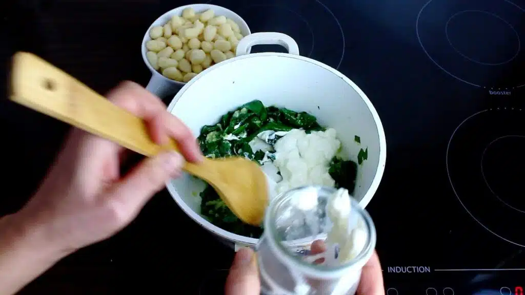 Low Carb Gnocchi mixing sour cream into the pot