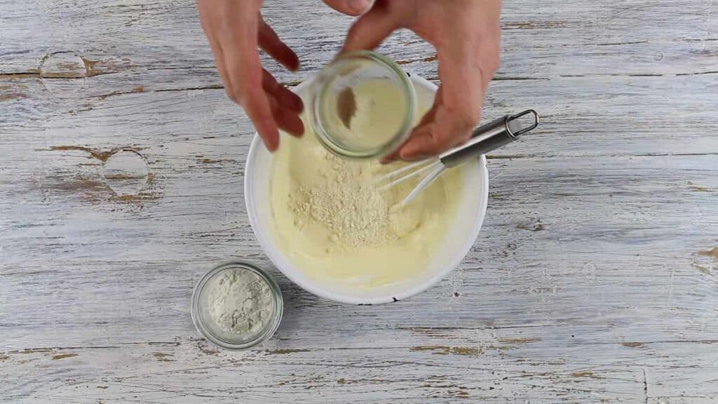 Keto Gnocchi Di Patate adding coconut flour into the mixture