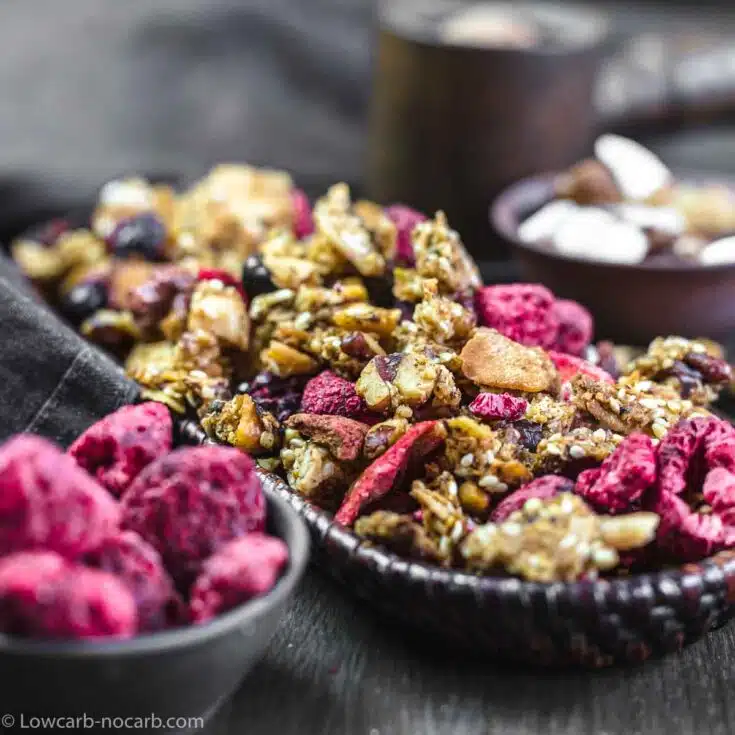 Homemade Low Carb Granola with dry Berries in a wooden bowl