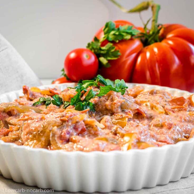 Lecso Vegetable Stew in a white casserole with Meat tomato behind