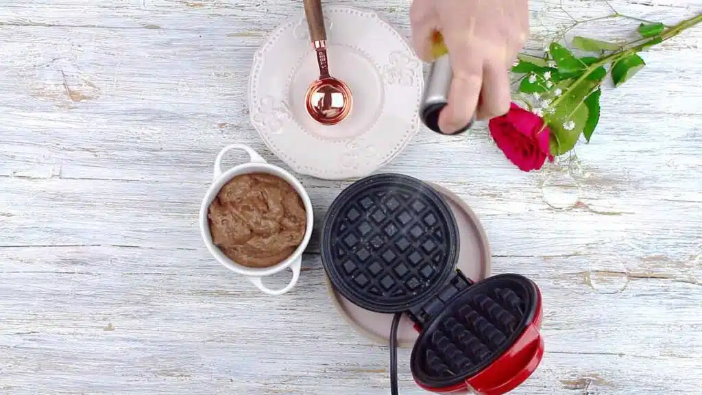 Quick and Easy Keto Chaffles spraying Dash mini waffle maker