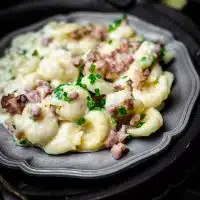 Low Carb Gnocchi with Bacon and Cheese placed on a metal plate