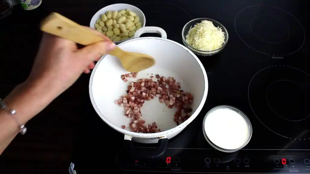 Keto Gnocchi With Bacon Cream Sauce cooking bacon until golden brown