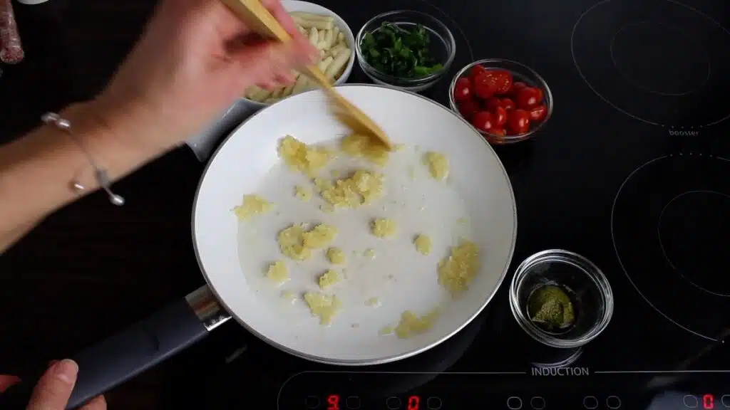 Keto Gnocchi Tomato Basil cooking crushed garlic
