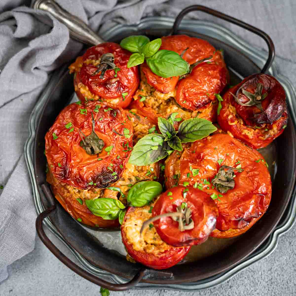 Mince Stuffed Tomatoes served on an old silver rounded plate