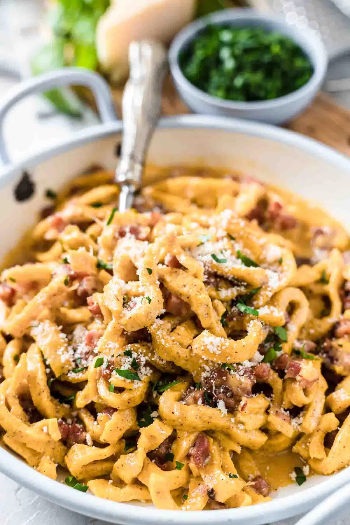 Keto Pasta Carbonara on a white plate with bacon and parmesan