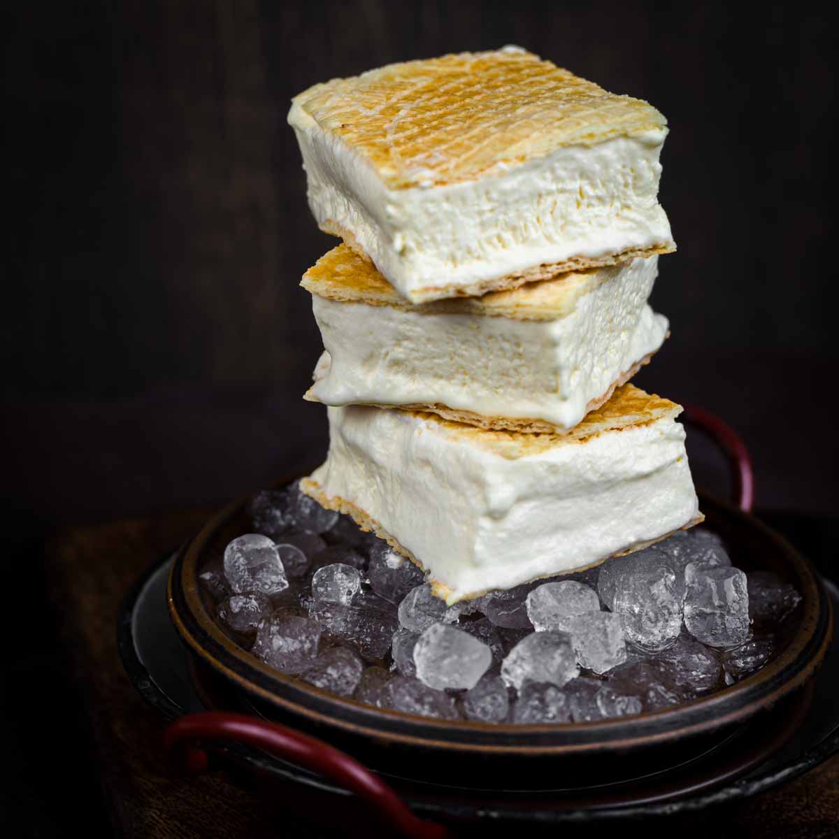 Sugar-Free Ice Cream Sandwich on a dark plate with ice cubes