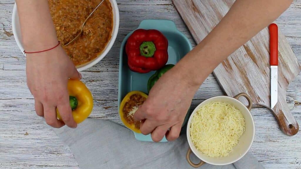 How To Make Easy Keto Stuffed Bell Peppers filling up with bolognese sauce