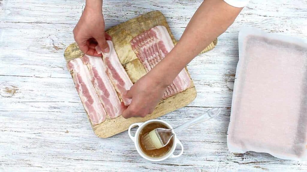 Pork Keto Candy spreading bacon for glazing