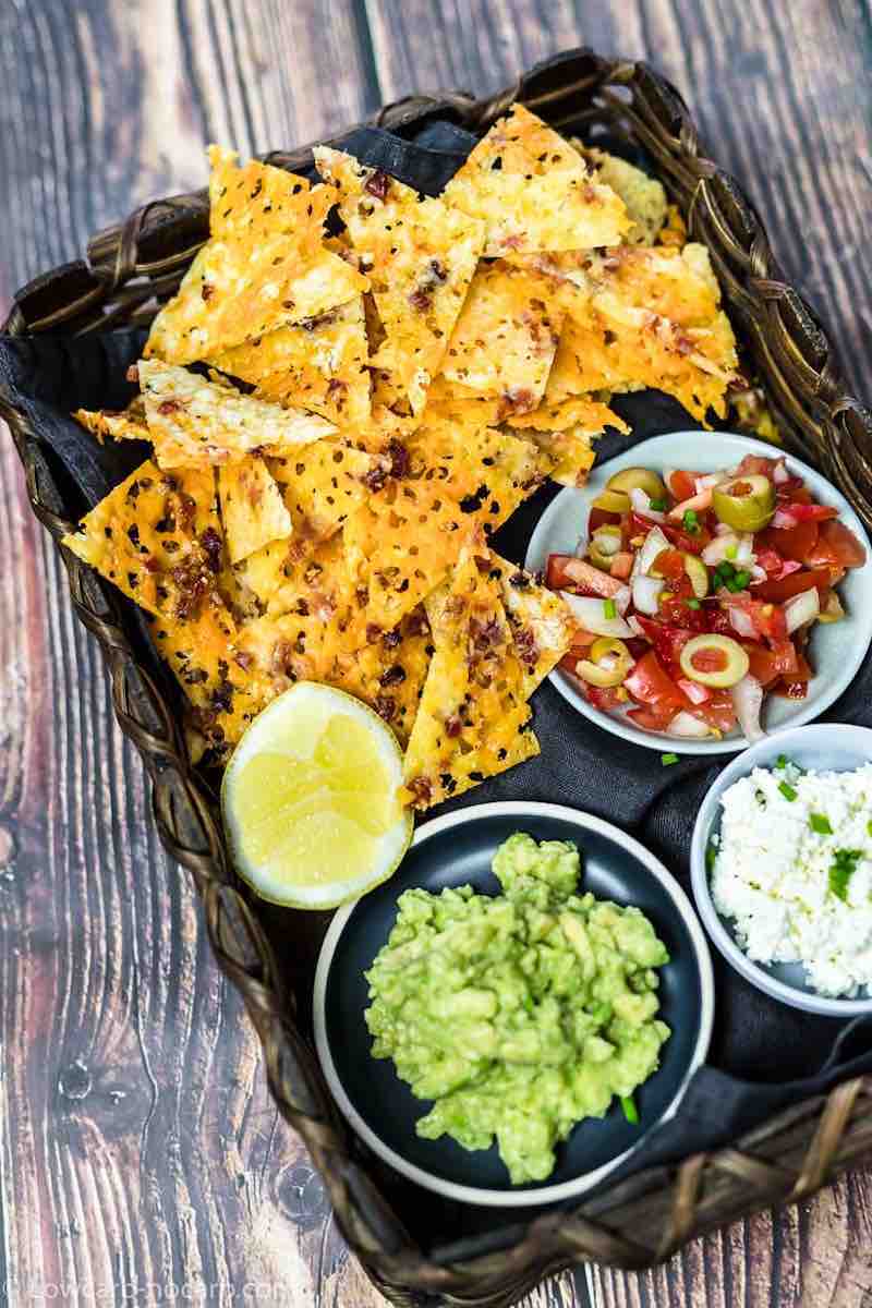 Low Carb Nachos in the wooden basket with dips