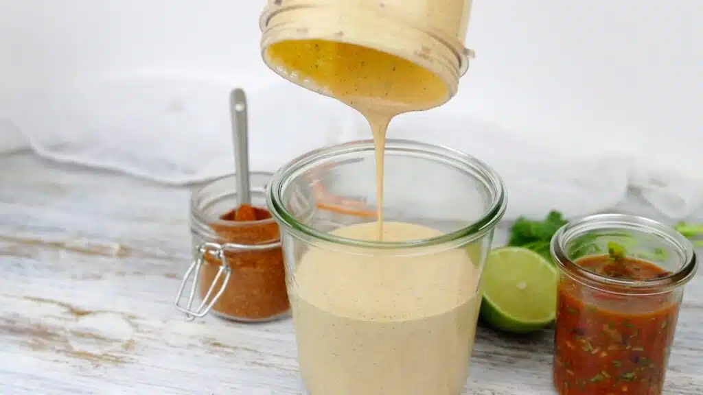 Creamy Salad Dressing pouring into the glass