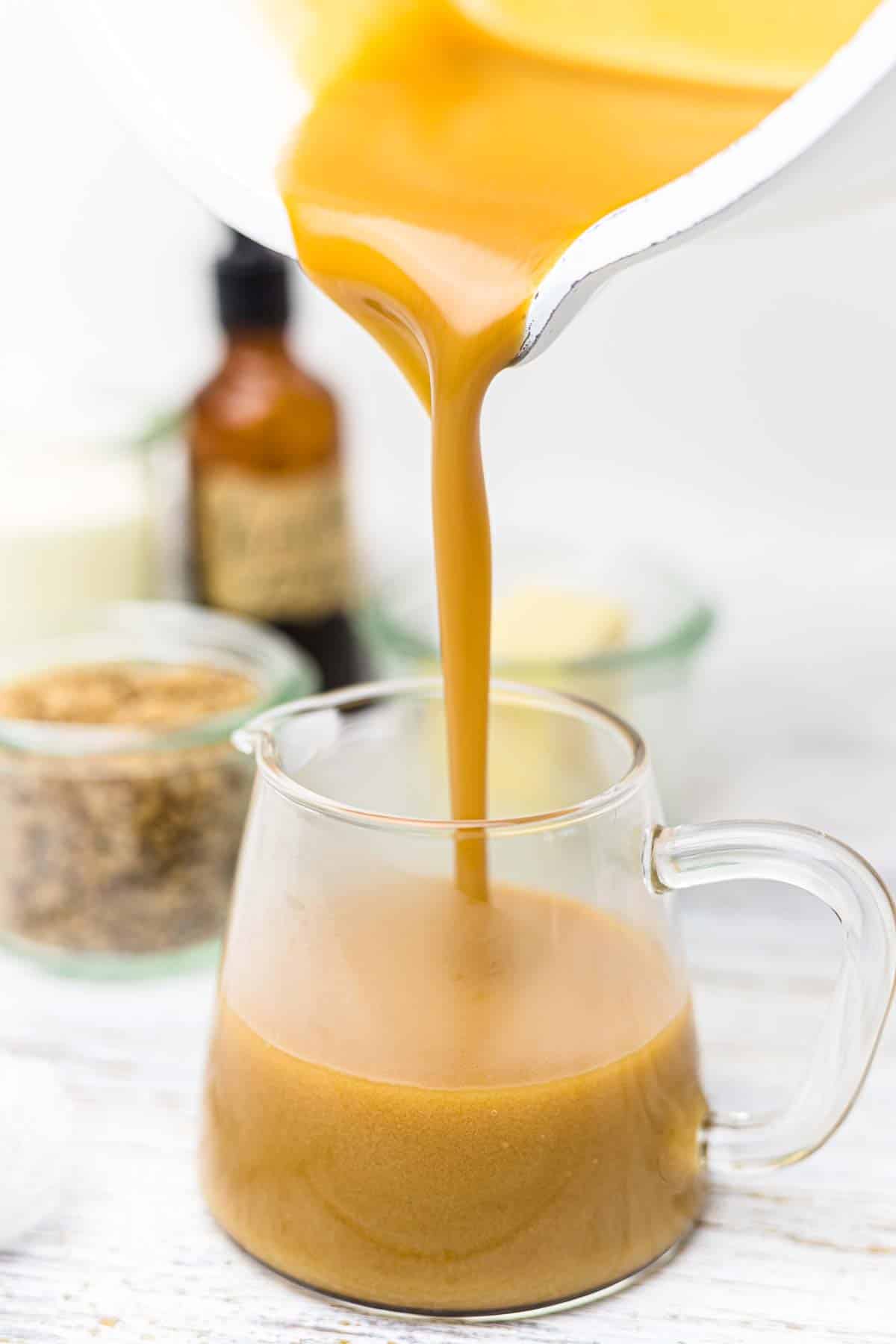 How To Make Keto Sugar-Free Caramel Sauce pouring into the glass