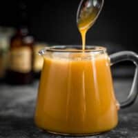 How To Make Keto Sugar-Free Caramel Sauce with a spoon pouring into
