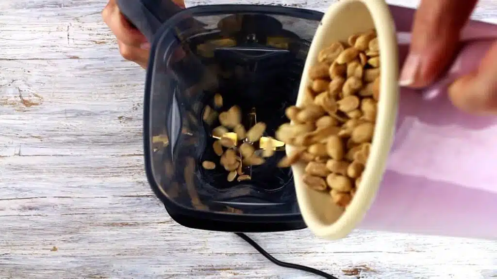 Lowest Carb Peanut Butter adding peanuts to the blender