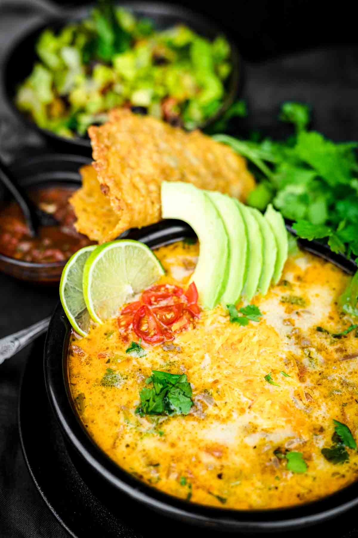 Quick and Easy Keto Taco Soup Recipe served with lime and avocado