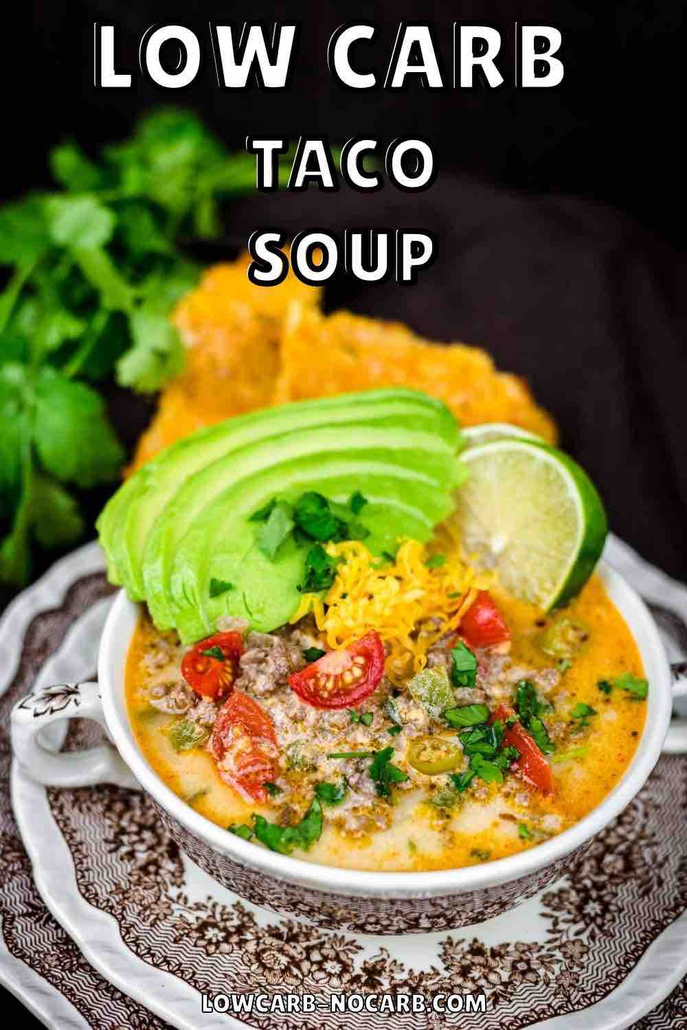 Low Carb Taco soup served with avocado and lime