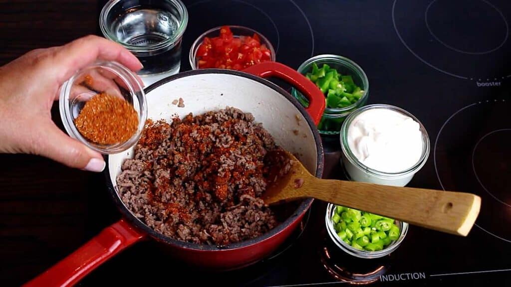 Quick and Easy Keto Taco Soup Recipe adding taco seasoning