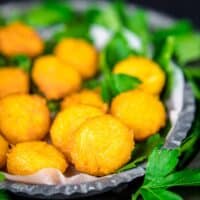 Keto Fried Cheese Balls served with greens