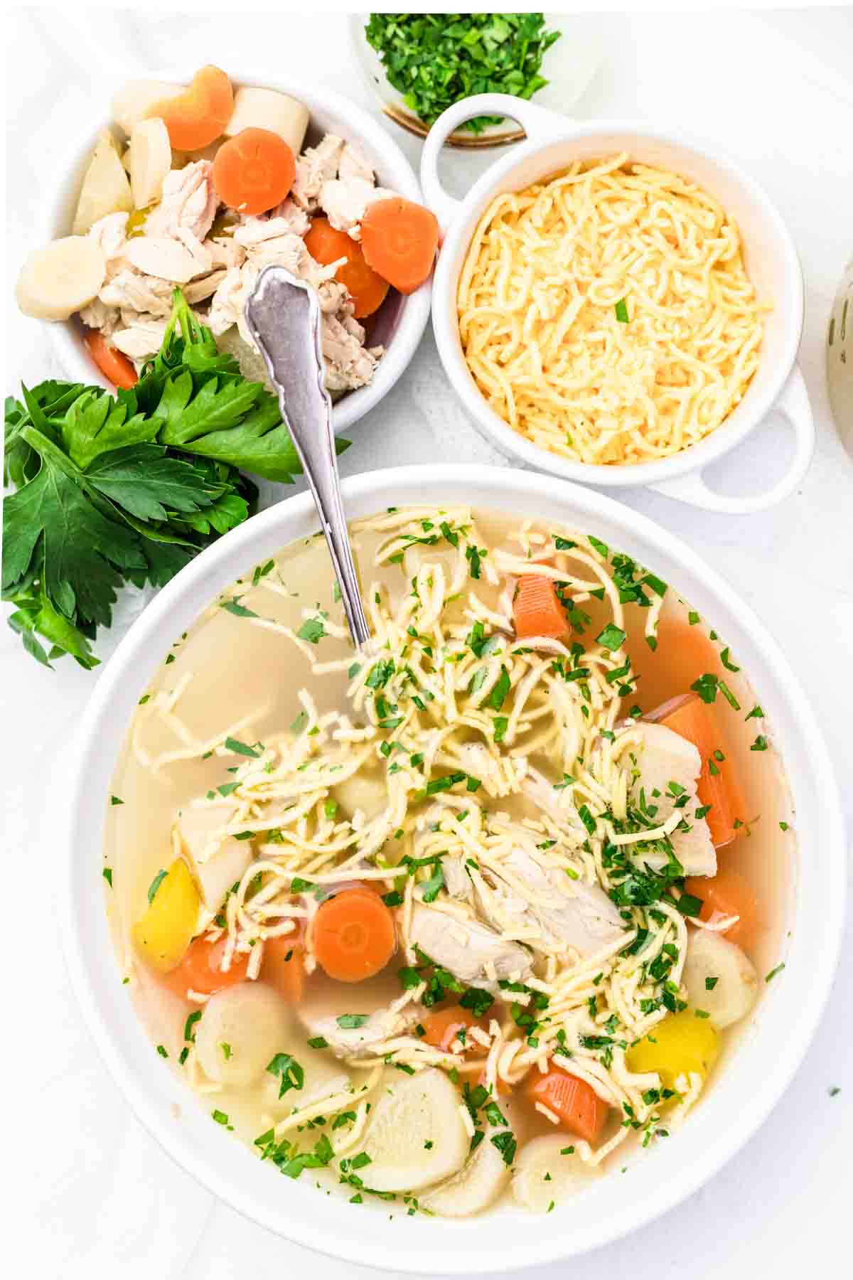 Low Carb Chicken Noodle Soup served in a white soup plate