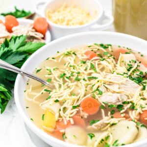 Chicken Soup with Noodles served in a white plate