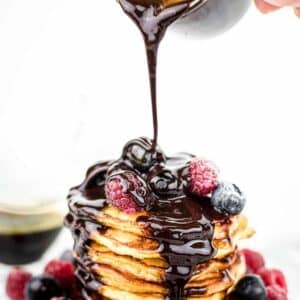 How To Make Sugar Free Chocolate Syrup poured on top of berries