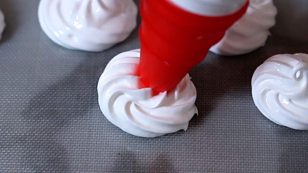 Sugar Free Meringue Cookies without Cream of Tartar piped on a silicone sheet