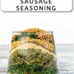 Homemade Sausage Seasoning Mix in a glass.